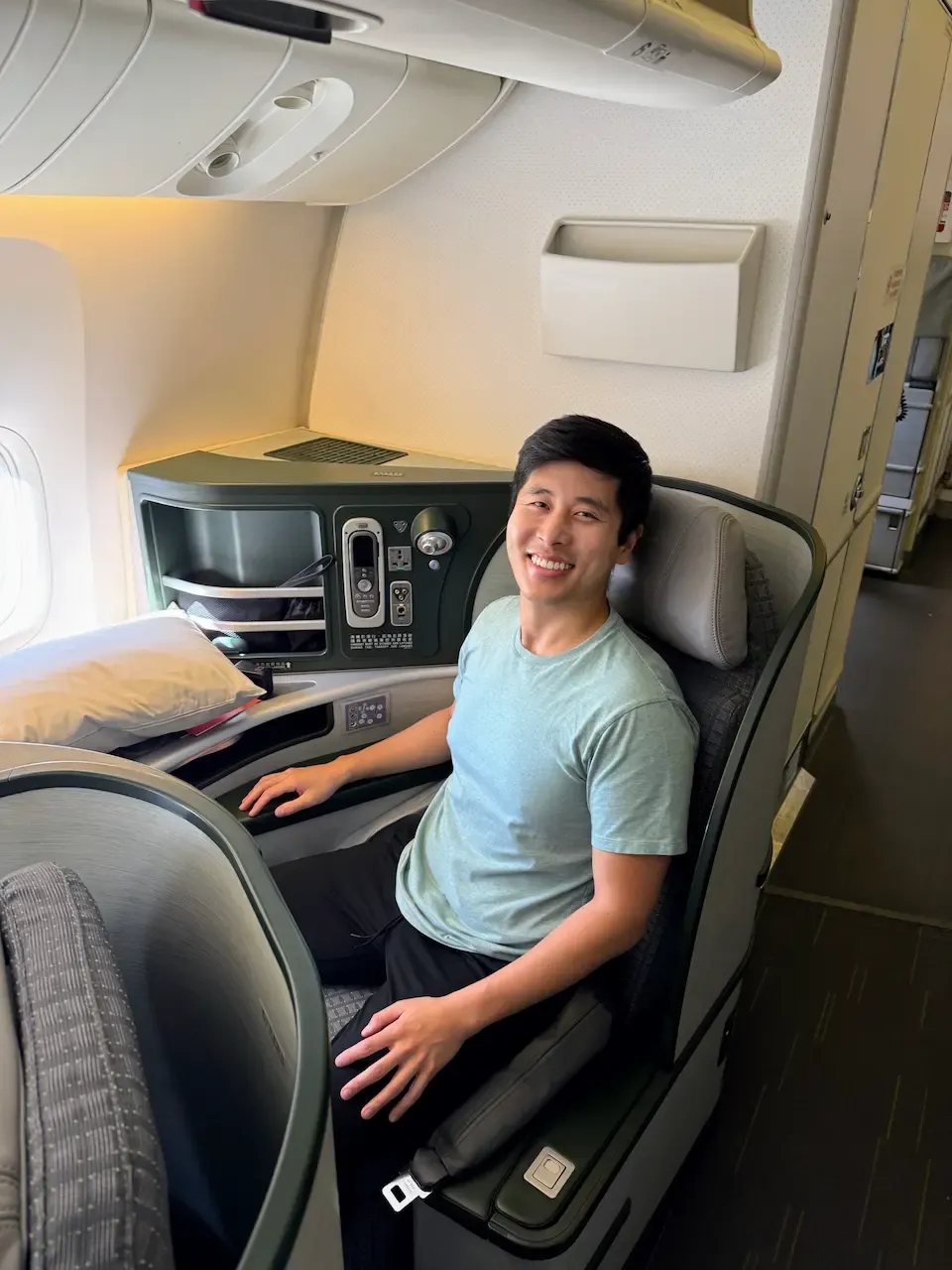 Person sitting in EVA Air business class by the window